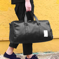 Black waterproof unisex sports fitness bag with diagonal straps and separate shoe compartments