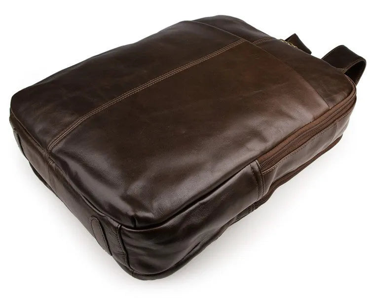 Top layer leather computer backpack in brown colour with zip closure designed to fit a 15 inch laptop