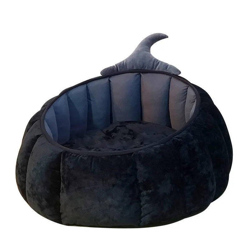 Halloween-themed orange pumpkin-shaped soft plush bed for a cat or small dog, featuring a cartoon devil design.