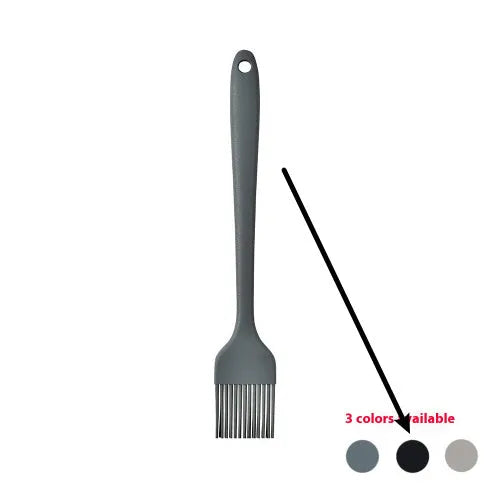 12-piece black silicone kitchen utensil set with tools stored in a rotating countertop storage bucket
