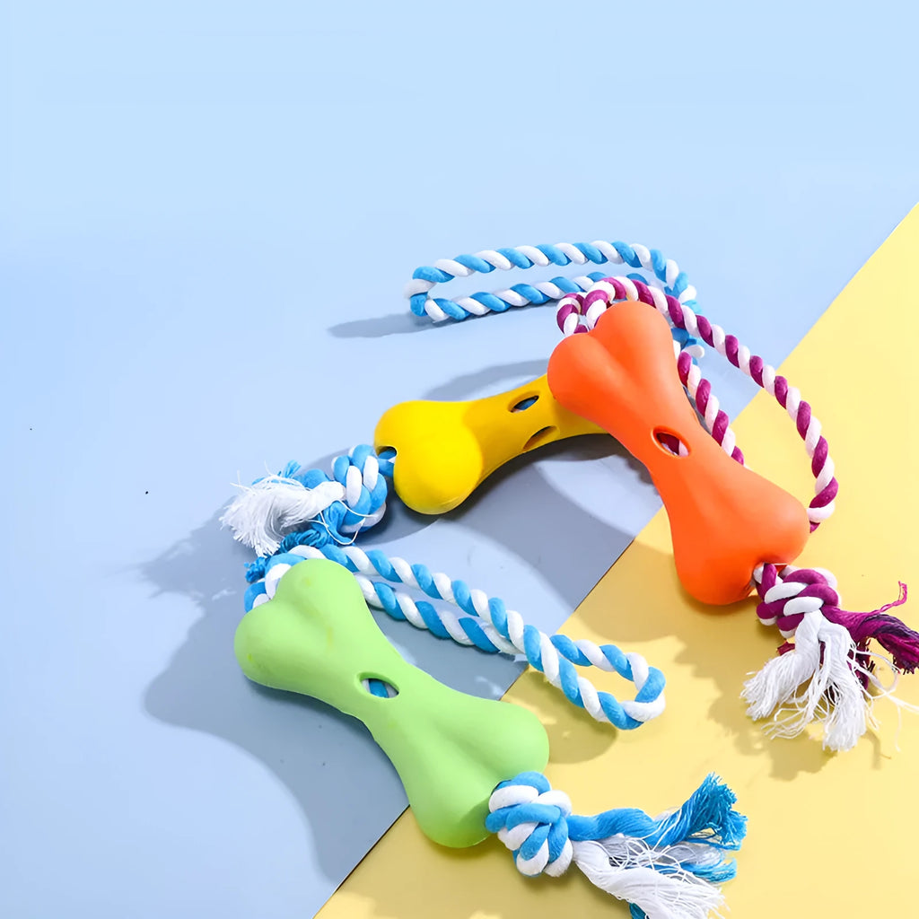Green porous bone-shaped dog chew toy with rope knot texture on a white background.