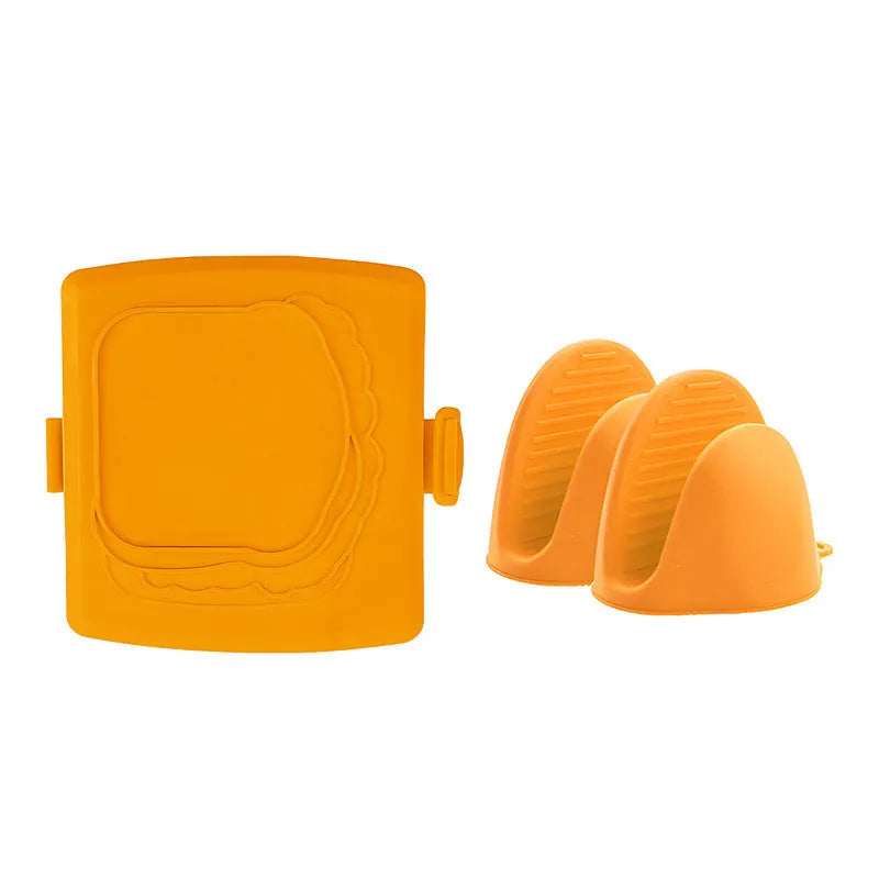 Red silicone baking tray and matching heat-resistant gloves set on kitchen counter