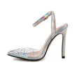 Women's pointed toe stiletto sandals with crystal diamond decoration on a PVC upper.