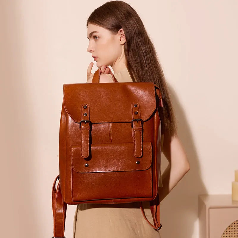 Hard cowhide leather computer backpack in black, brown, or coffee with lining cloth interior
