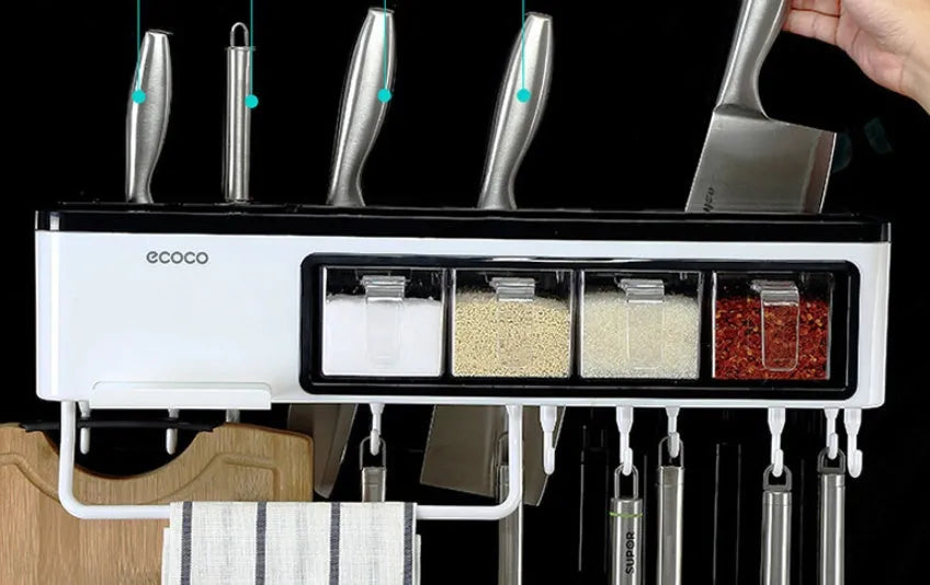 White plastic multi-function wall-mounted kitchen storage rack holding utensils and seasoning bottles