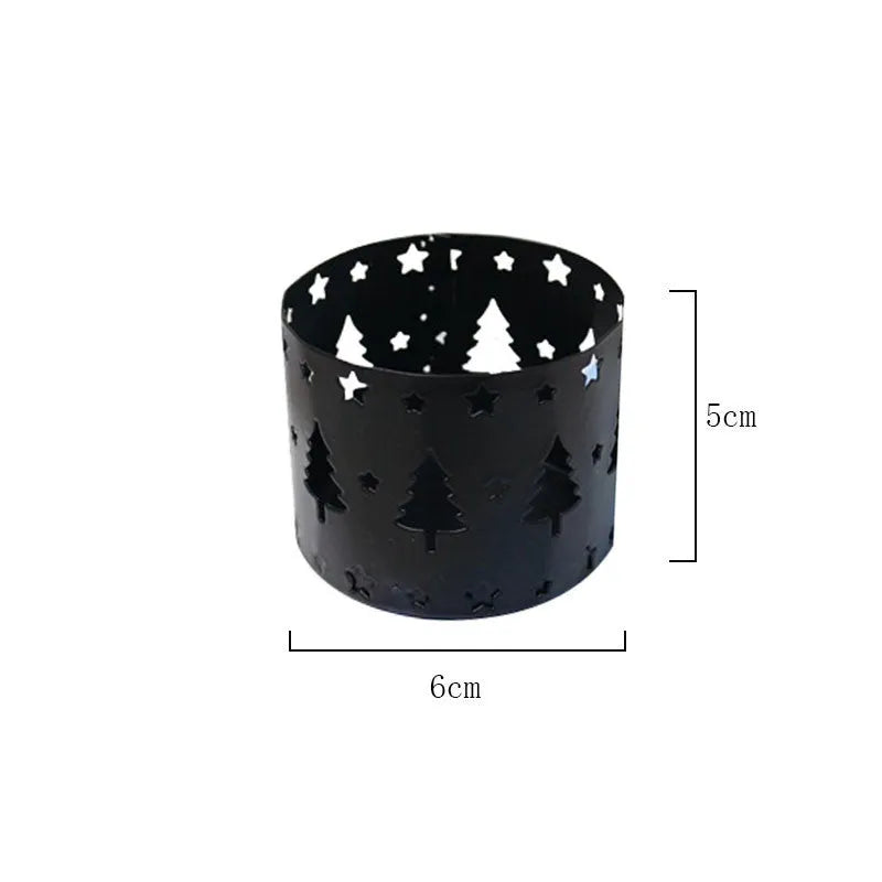 Black iron Christmas candlestick with decorative elk bracket and Santa Claus motifs