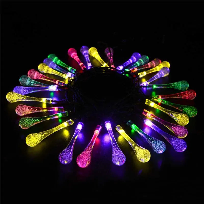 Solar LED string lights with bubble drop pendants for outdoor garden decoration