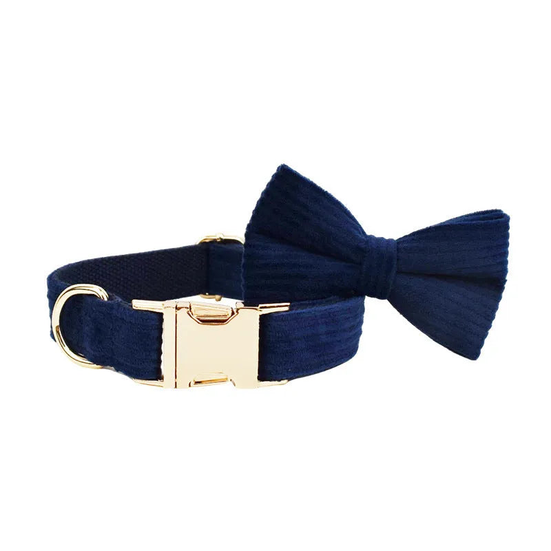 Navy blue corduroy dog collar set with matching leash, vest, bow, and poop bag