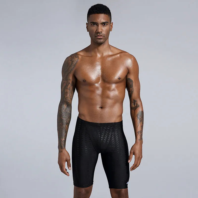 Men's solid colour swimming trunks in waterproof polyester fabric available in larger sizes