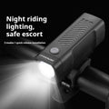 USB rechargeable bicycle headlight with LED lamp and quick release strap bracket on handlebars.