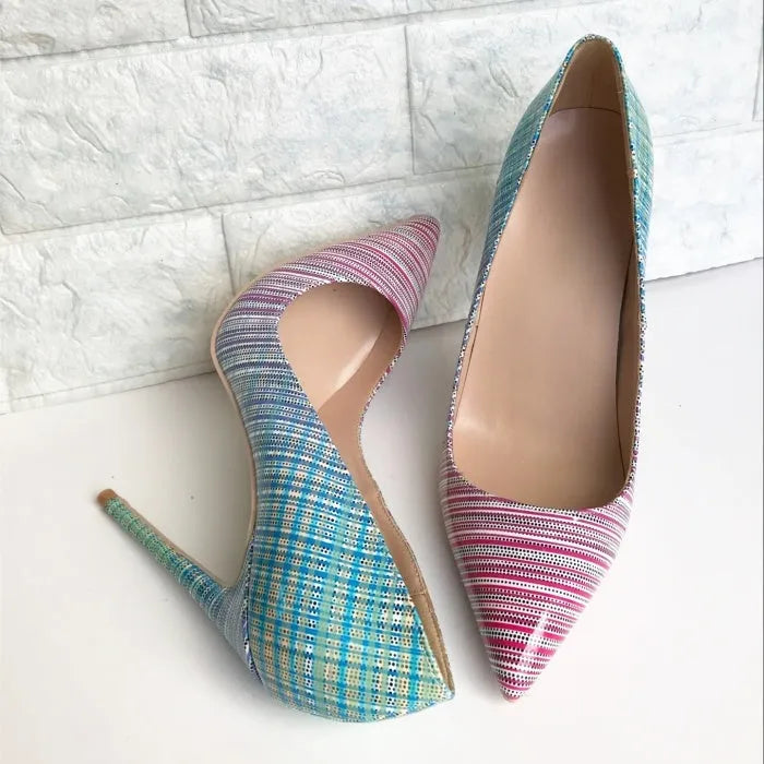 Pink to blue gradient patent leather ladies high heel shoe with pointed toe on a white background