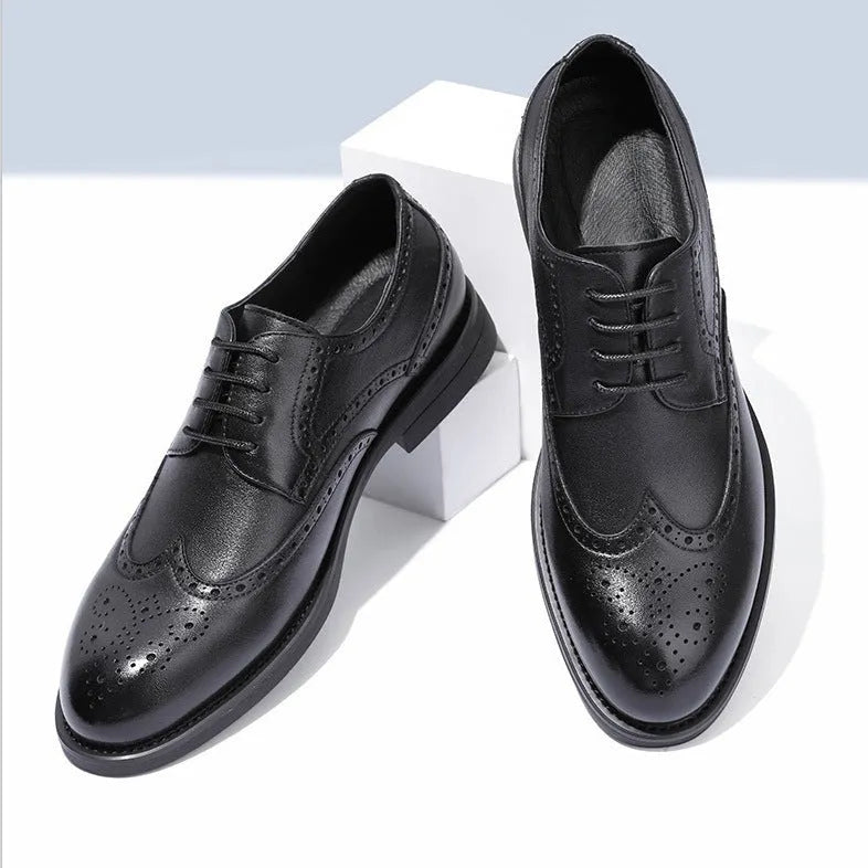 A pair of men's classic black brogue business shoes with a PU leather upper.