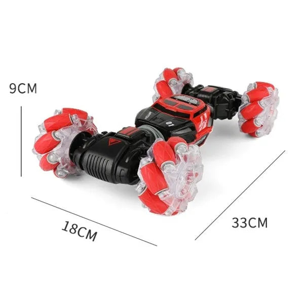 Red remote control stunt car with gesture control, morphing off-road tyres, lights, and music, measuring 32 cm long