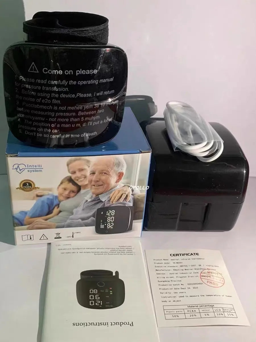 Black rechargeable wrist blood pressure monitor with digital display on a table.