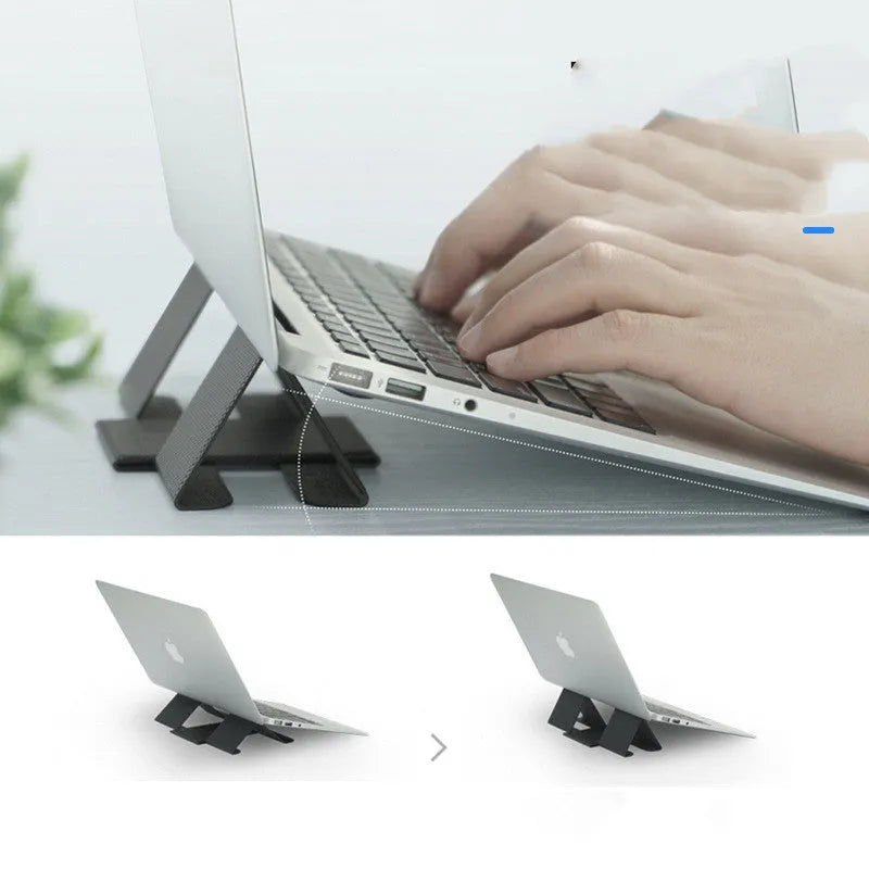 Ringke Folding Stand2 portable laptop stand in grey, folded open with a notebook placed on top