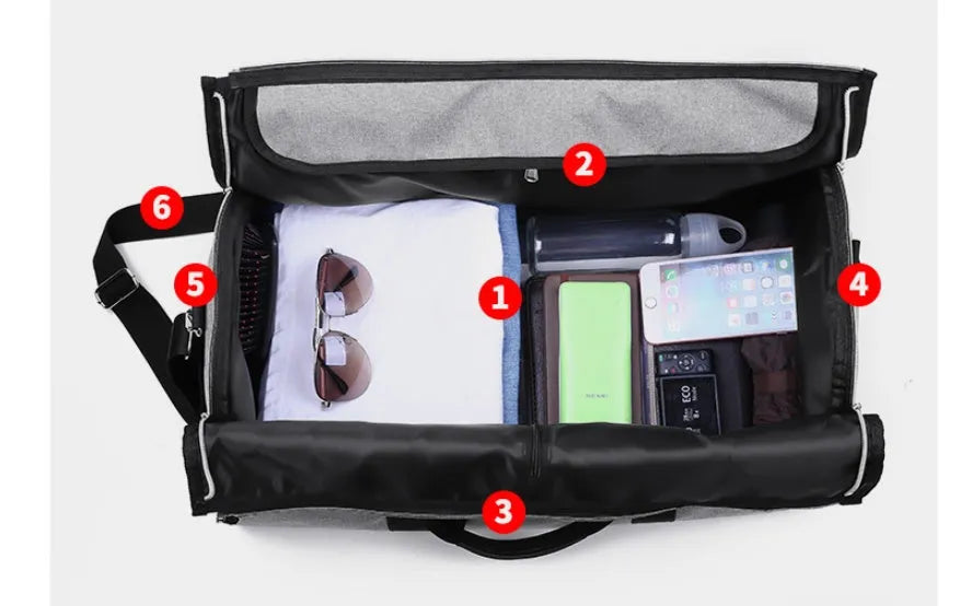 Medium sized cylinder travel bag in black Oxford cloth, showing zipper opening and internal pocket.