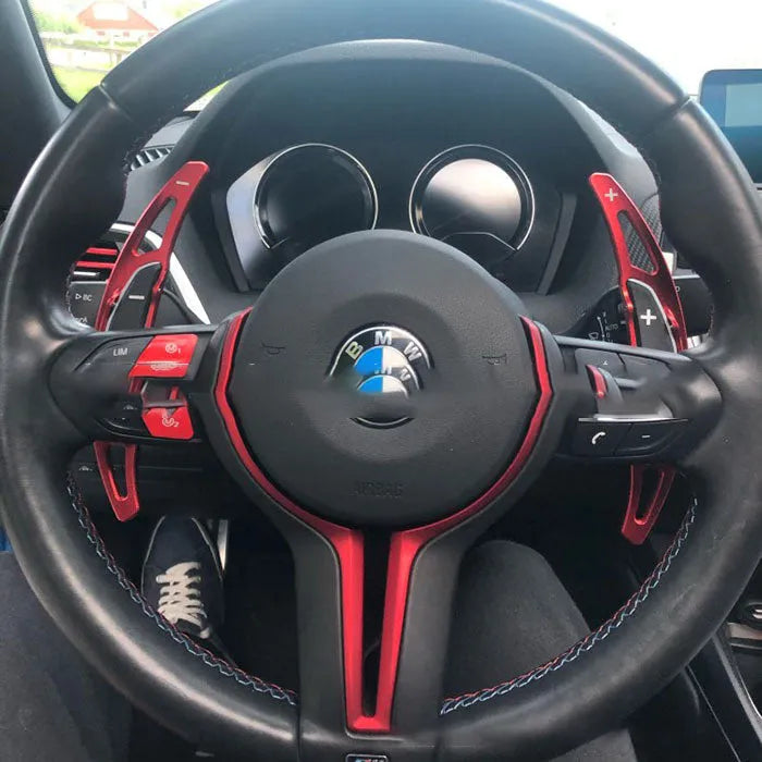 Pair of BMW M paddle shift extenders in black with screw and glue attachment