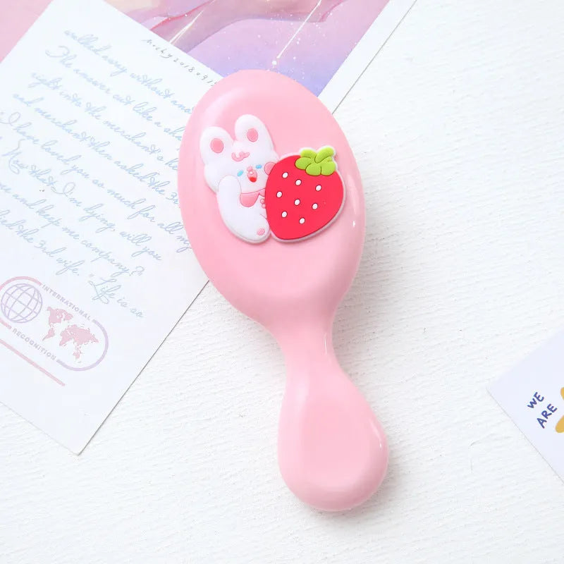 Portable resin massage comb for students, 15-20cm, in cute cartoon designs including strawberry and bunny.