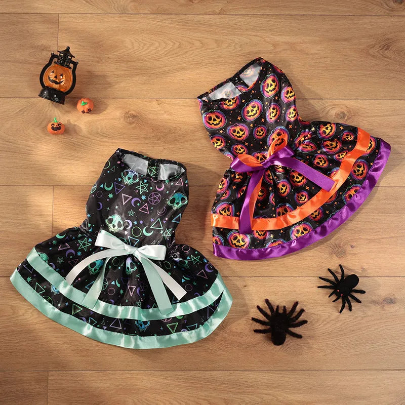 A dog wearing a double-layer orange Halloween skirt with a colourful pumpkin print.