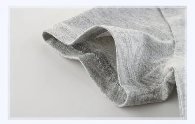 Grey cotton children's t-shirt laid flat, showing Asian size tags for 90cm, 100cm, 110cm, 120cm, 130cm, and 140cm lengths.