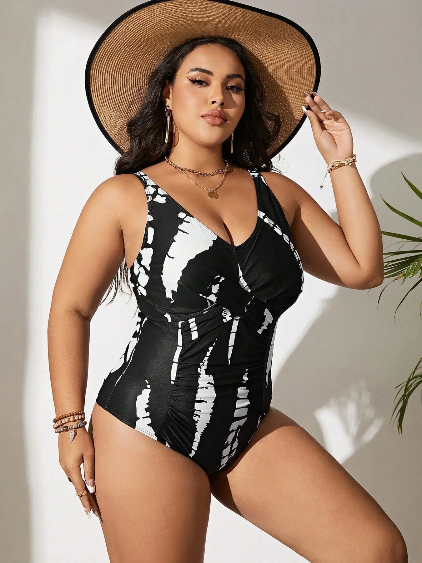 Black Siamese colour matching fit one-piece swimsuit for women on a size chart.
