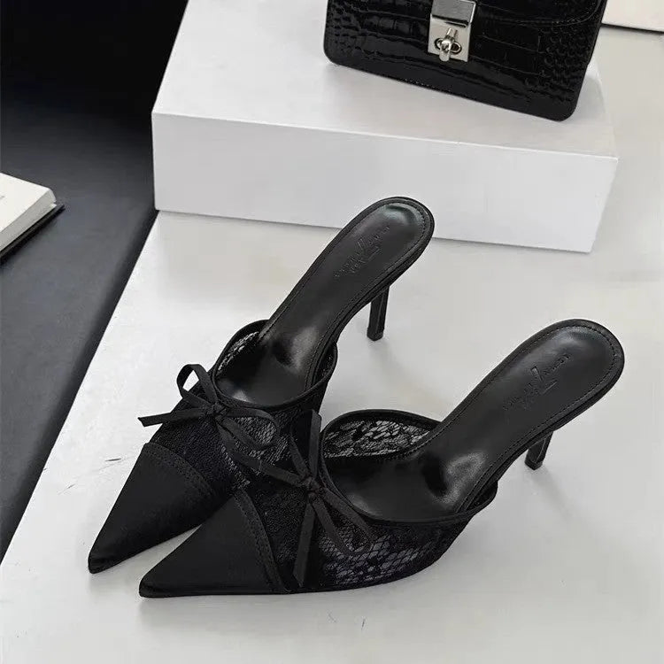 Women's light brown lace bowknot pointed toe high heels with mesh upper on a neutral background.