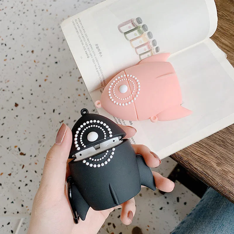 Pink silicone protective case on an AirPods wireless charging case.