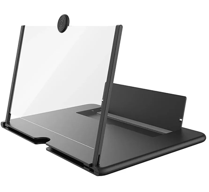 Folding mobile phone screen amplifier in black, with phone inserted, showing 3-4x magnification on a desk