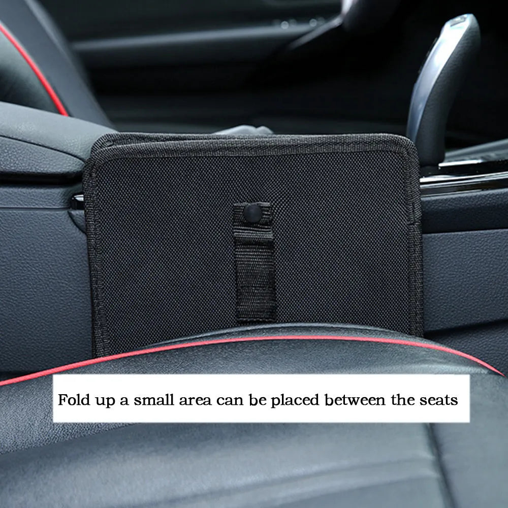 Foldable Oxford car wastebasket 22x22x15cm hanging from car seat with snap closures