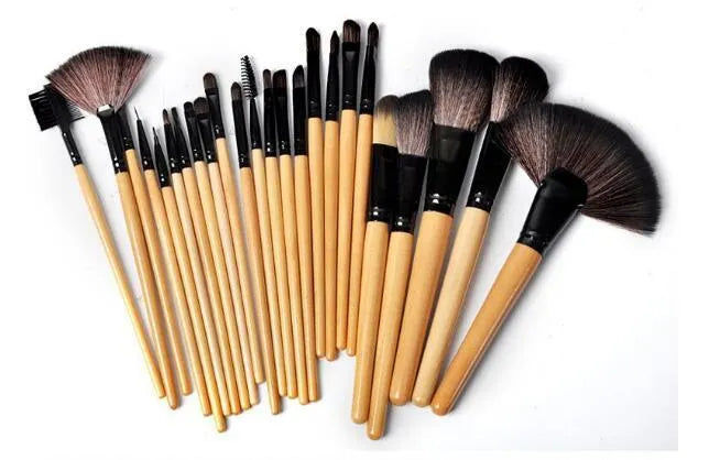 24 professional makeup brushes with wooden handles in a black PU gift bag