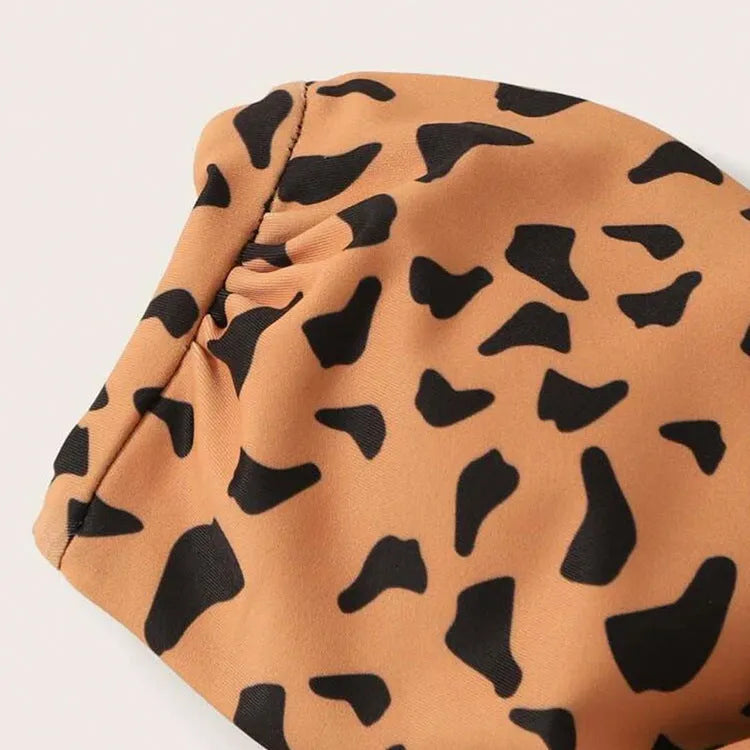 Women's split swimwear bikini set in leopard print with nylon and polyester fabric, available in sizes S M L XL