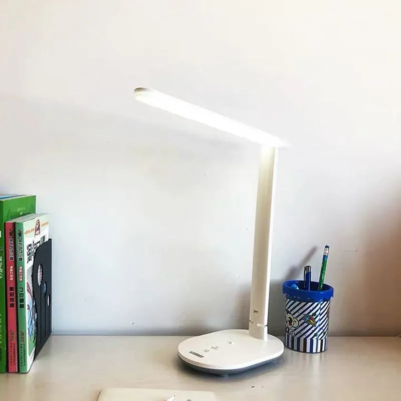 White LED charging table lamp with touch switch and ABS shade on a desk