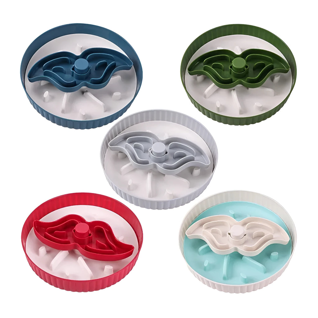 Grey pet slow feeder bowl with rotating windmill-pattern top and a white anti-choke silicone pad in the centre.