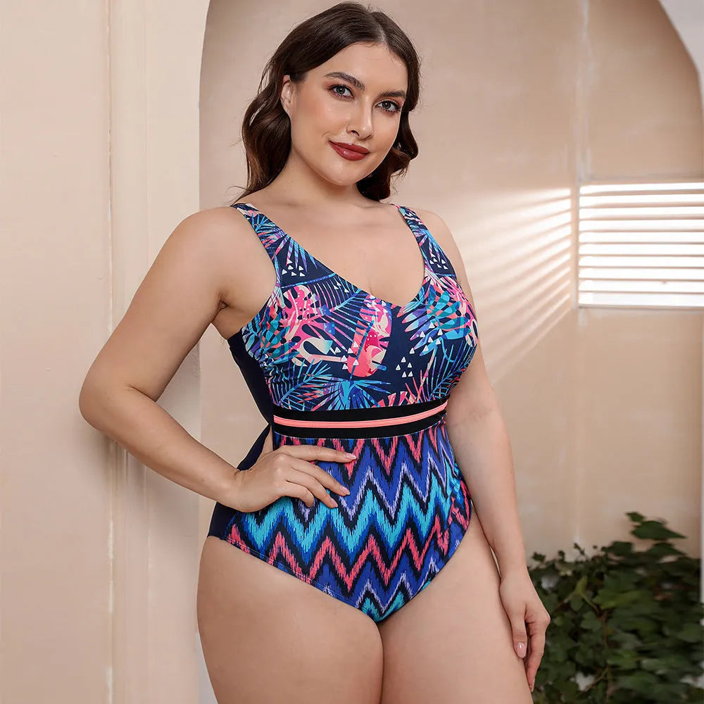 Women's blue printed one-piece swimsuit with spaghetti straps on a mannequin.
