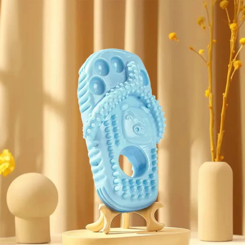 Durable rubber dog chewing toy in slipper shape, blue colour, on light background