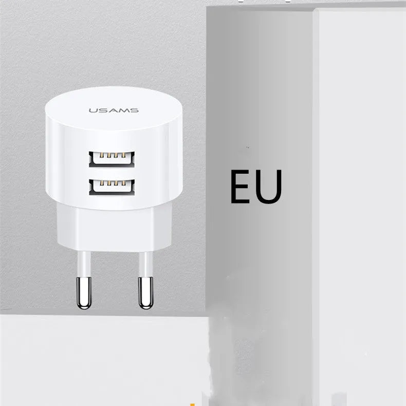 White portable universal dual USB phone charger with US, EU, and UK plug heads