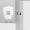 White portable universal dual USB phone charger with US, EU, and UK plug heads
