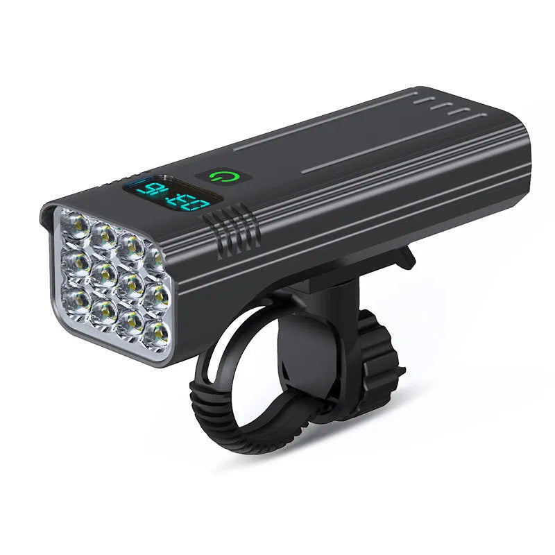 Black KX12DF digital display bicycle headlight with aluminium alloy body mounted on a handlebar bracket.