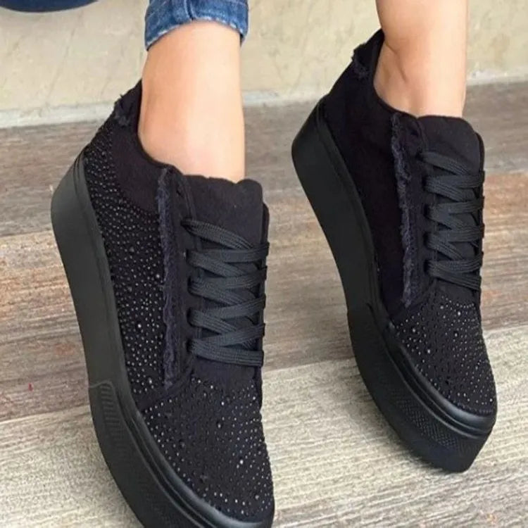 Plus size women's black lace-up casual shoes with rhinestone detail and thick rubber sole.