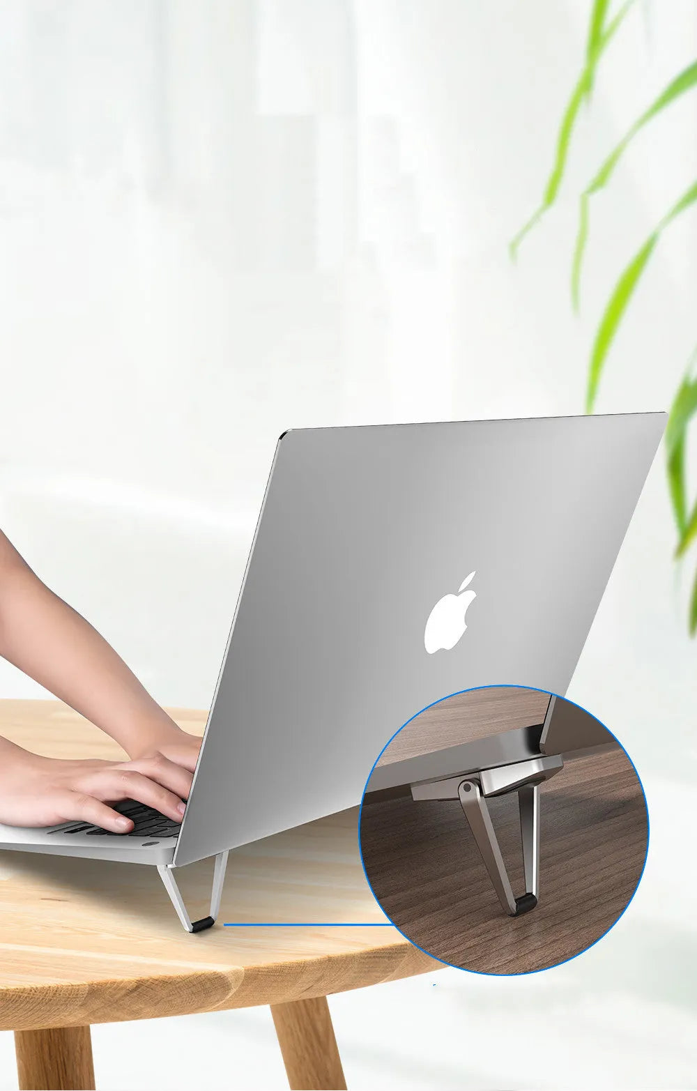 Two black and silver zinc alloy metal foldable tablet computer cooling brackets on a desk, 4.8cm size