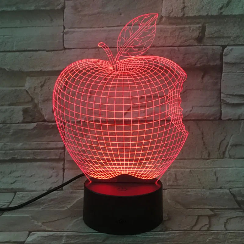 Colour-changing fruit-shaped acrylic night light with touch control on a surface.