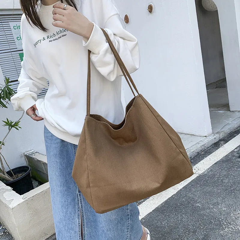 Solid colour women's canvas handbag with double shoulder straps and mobile phone compartment