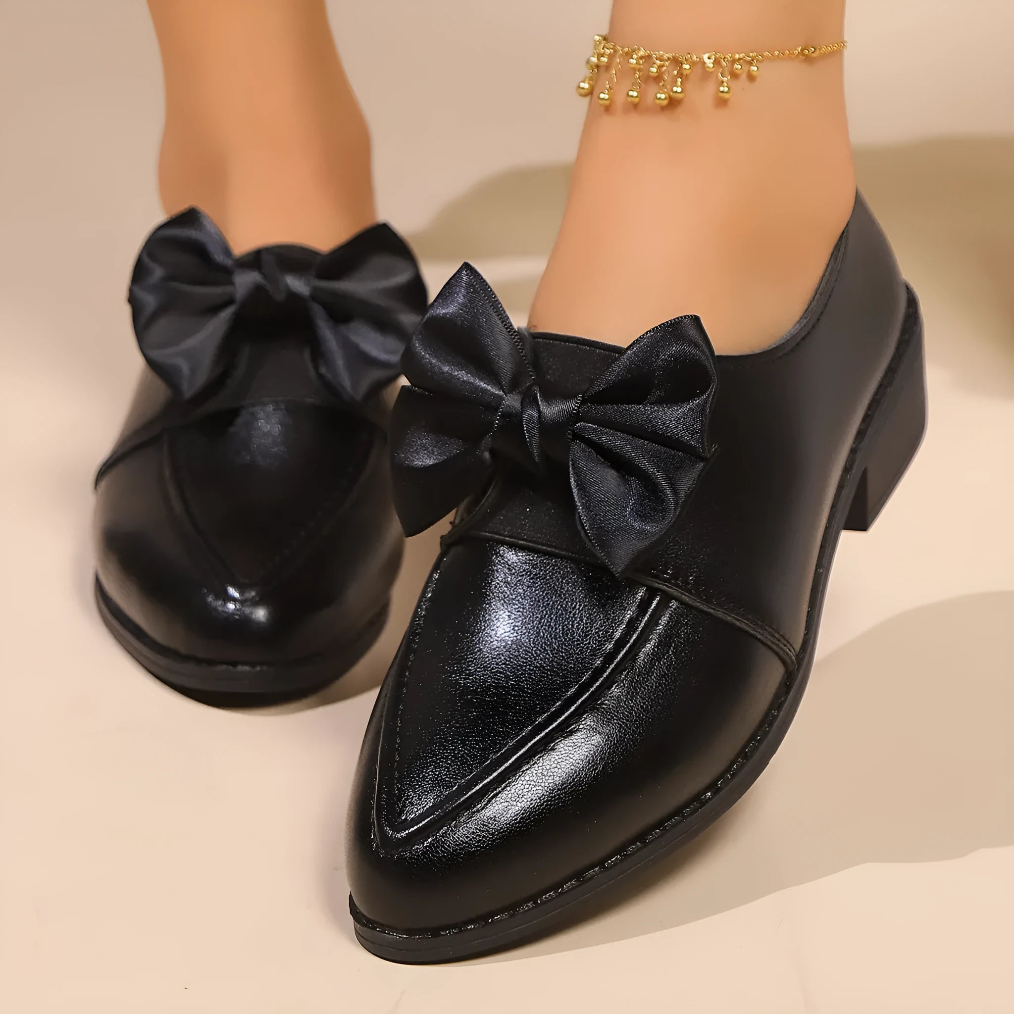 Women's slip-on shoe with a decorative bow on a pointed toe, available in buckle big bow or small bowknot styles.