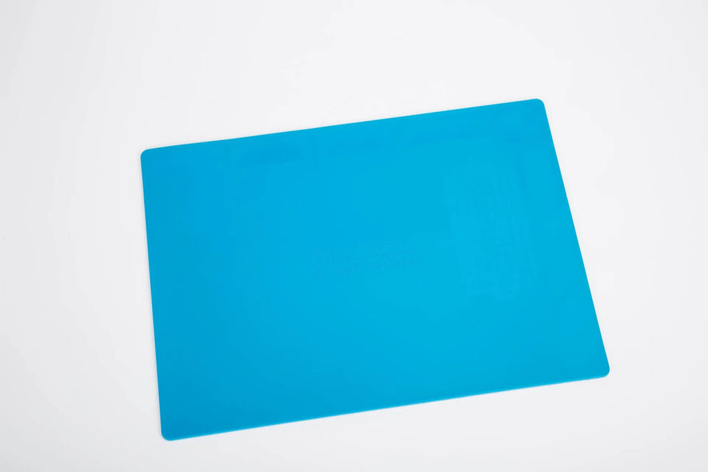 Blue silicone watch repair desk mat with anti-slip textured surface for jewellery tools