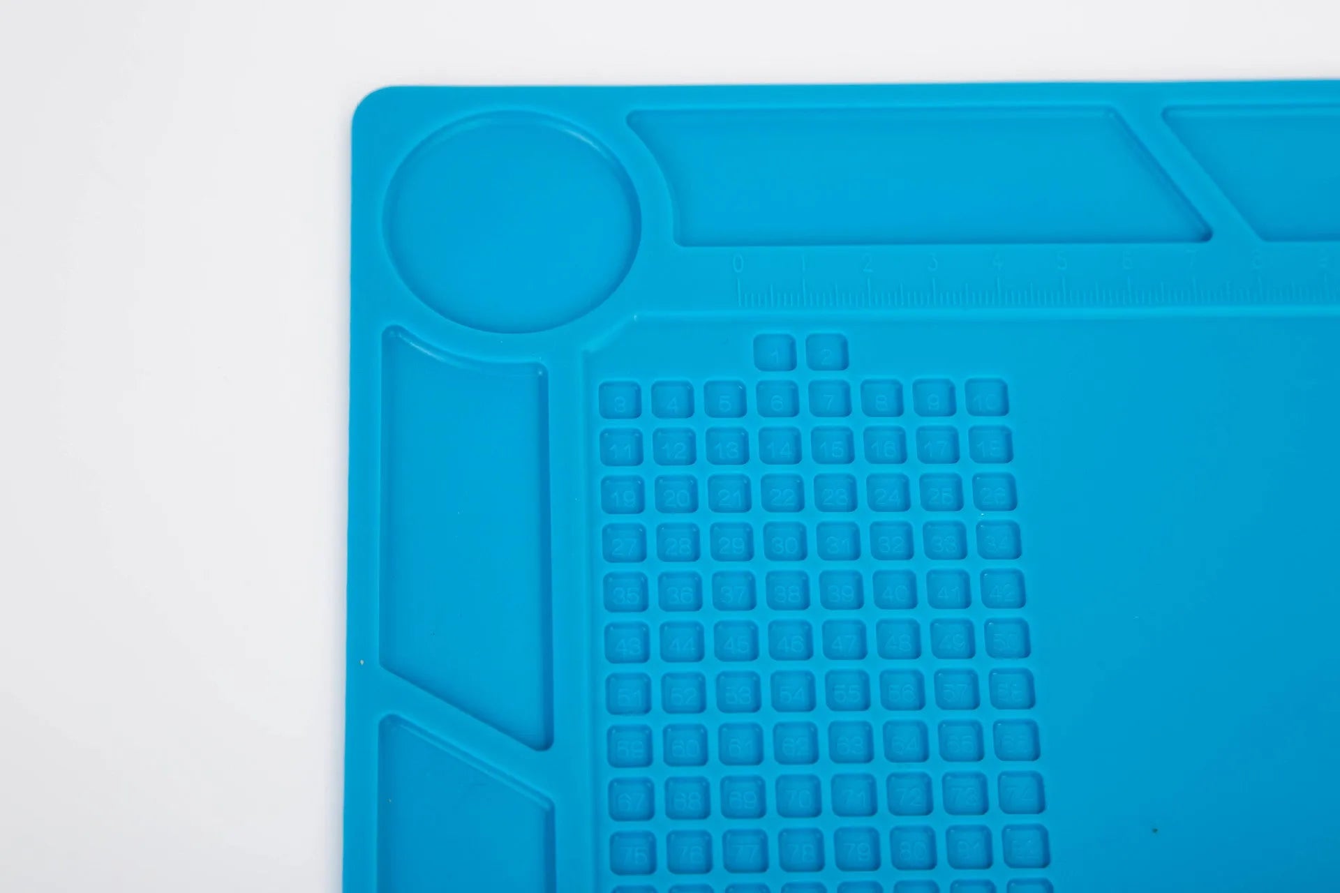Blue silicone watch repair desk mat with anti-slip textured surface for jewellery tools
