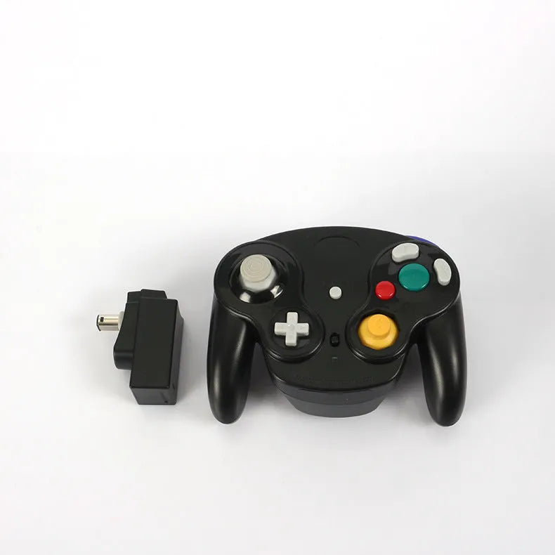 NGC wireless game controller for Wii and GameCube in multiple colours on a white background.