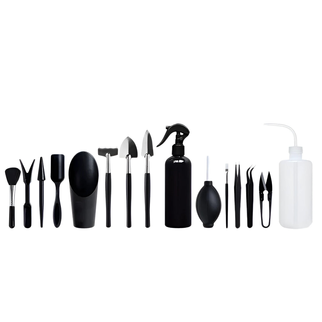Black plastic and metal mini garden tool set for succulents, with tools laid out on a 75cm square cushion.