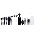 Black plastic and metal mini garden tool set for succulents, with tools laid out on a 75cm square cushion.