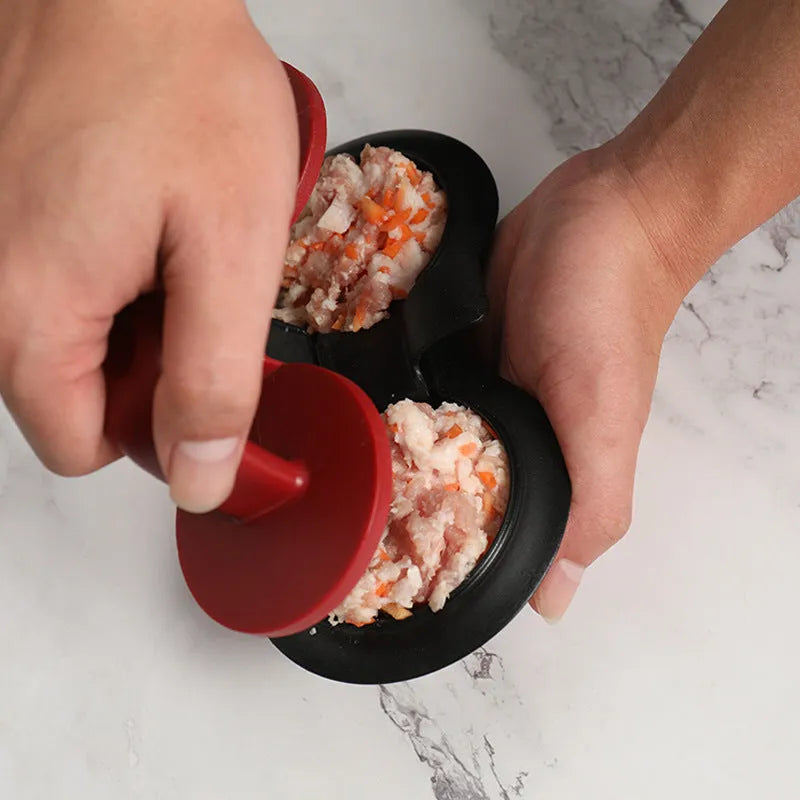 Black food-grade ABS burger press kitchen gadget on a kitchen counter.