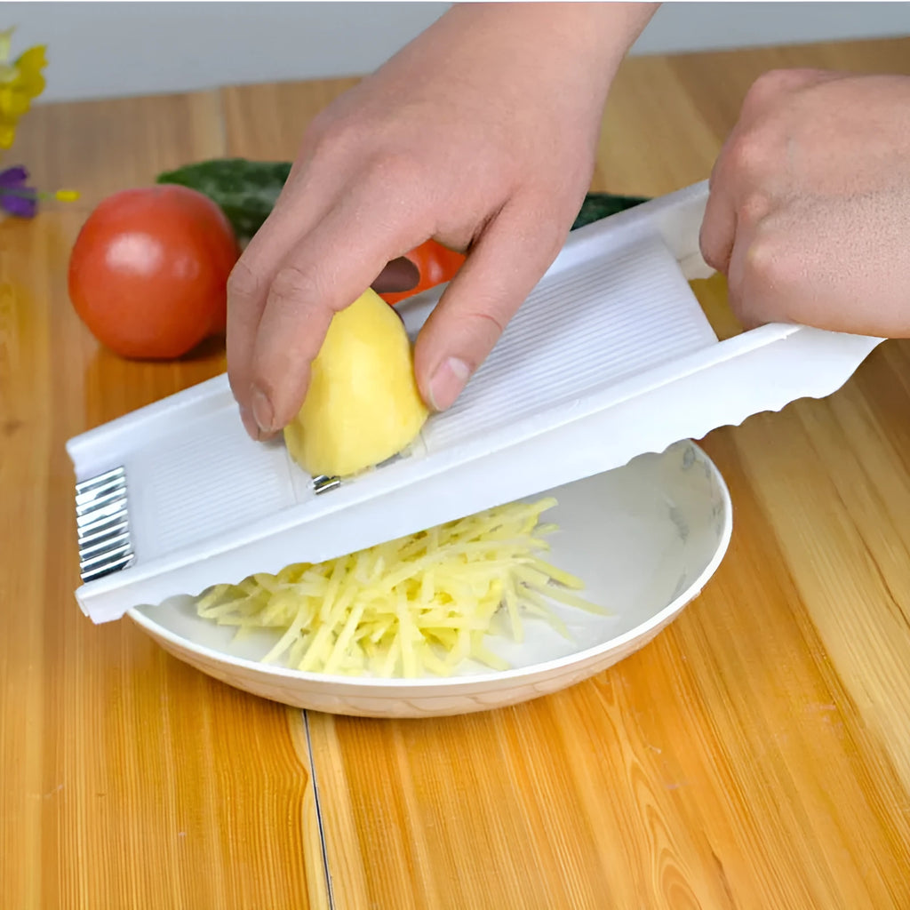 White home kitchen multifunctional grater set with stainless steel blades, hand guard, and main body measuring 28.3 by 13.2 cm.